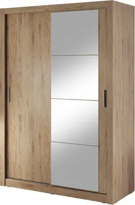 A wardrobe with sliding doors and mirrored panels.