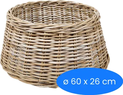 A woven basket, likely for a Christmas tree, is shown against a white background.