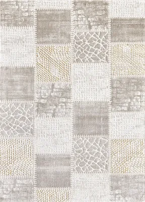 A flat lay of a patchwork rug with various textures and patterns.