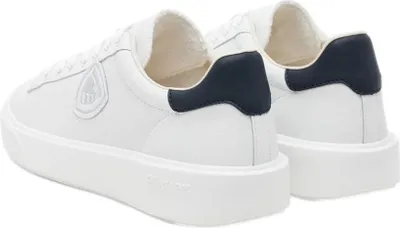 A pair of white sneakers with navy accents.
