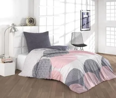 A bedroom scene with a bed, chair, and lamp.