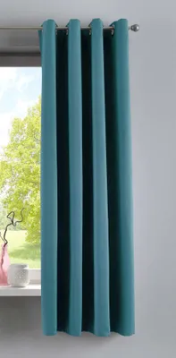 A teal curtain hangs in front of a window, with a glimpse of greenery outside.