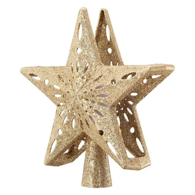 A gold glittery star-shaped Christmas tree topper with cut-out patterns.