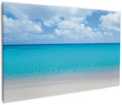 Produktbild von Wallario Premium Leinwandbild Sandstrand und blaues Meer in Größe 60 x 90 cm