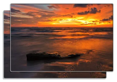 Produktbild von Wallario Frühstücksbrettchen 2er Set aus Glas, je 20 x 30 cm, mit rutschfesten Füßen, Motiv Glühender Abendhimmel über dem Meer