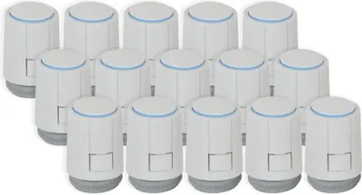 A group of white and gray thermostatic radiator valves are arranged in a grid formation against a white background.