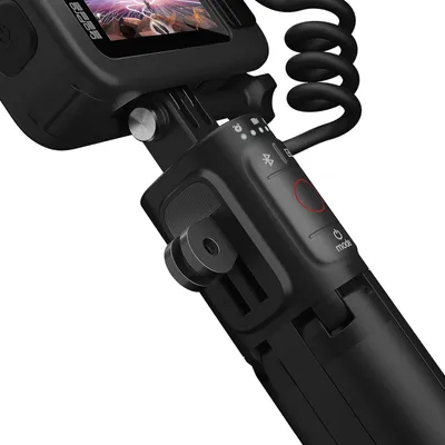 A close-up shot of a black GoPro camera attached to a grip/handle.