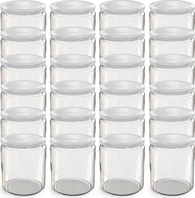 A grid of empty glass jars with white lids.