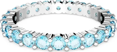 A close-up studio shot of a ring with blue stones.