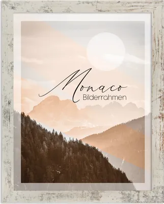 A framed picture of mountains with text overlay.