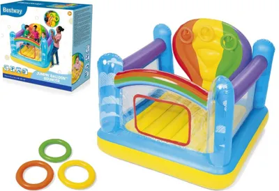 An inflatable bouncy castle with a rainbow and hot air balloon theme, along with its packaging and three rings.