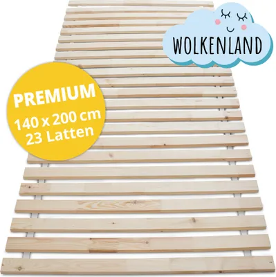 A wooden slatted bed base is shown diagonally from a slightly elevated side view against a white background. A yellow circular sticker with product details and a light blue cloud shape with text "WOLKENLAND" are overlaid on the image.