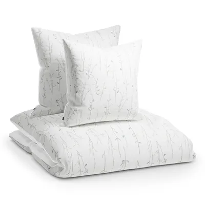 A stack of bedding with two pillows on top of a duvet cover.