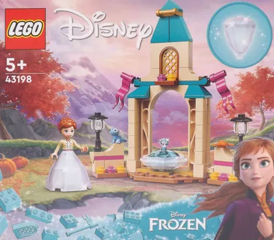 The image shows the packaging for a LEGO Disney Frozen set, featuring Anna and a small castle courtyard with a fountain. The background depicts a scenic landscape with mountains and autumn trees.