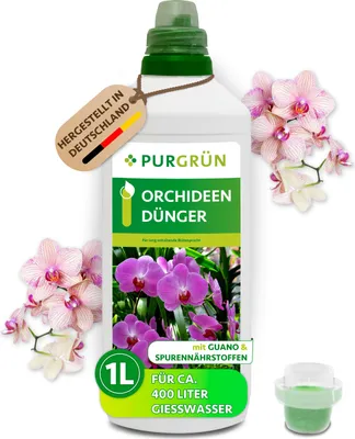 A bottle of orchid fertilizer with orchids surrounding it.