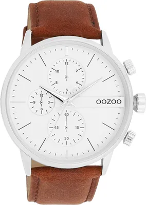 Close-up shot of a men's wristwatch with a white face and brown leather strap.