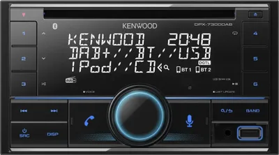 A close-up front view of a Kenwood car stereo with its display screen showing various information.