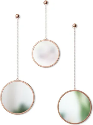 Three round mirrors with copper-colored frames and chains hanging against a white background.