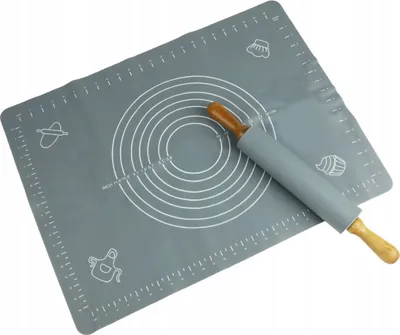 A grey silicone baking mat with measurement markings and illustrations, and a rolling pin with wooden handles.