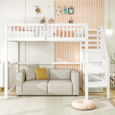 A white loft bed with stairs is shown above a gray sofa with yellow and gray pillows. The background features a light pink ribbed wall and white walls with photos clipped to strings.