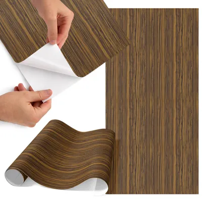 Produktbild von Möbelfolie 65x130 cm - Klebefolie Möbel - Selbstklebende Folie - Folie für Möbel - Möbelfolie Küche - Klebefolie Küche - Möbelfolie Schrank - Wasserdicht - Abwaschbar - Selbstklebend - Luftblasenfrei - Rückstandslos entfernbar - Holzstruktur