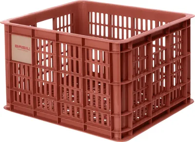 A close-up, studio shot of a red plastic crate.