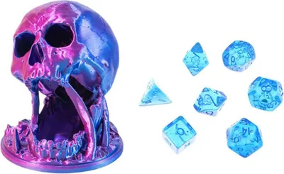 A skull-shaped dice tower and a set of dice are displayed against a white background.
