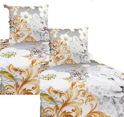 A close-up view of bedding with a leopard and floral pattern.
