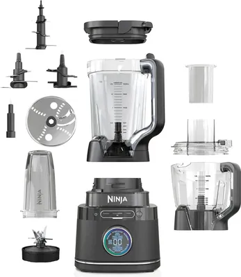 A collection of Ninja blender parts and accessories laid out on a white background.