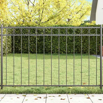 A metal fence element in a garden setting.