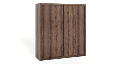 A wooden wardrobe with sliding doors.