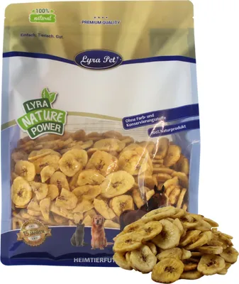 A bag of dried banana chips for pets, with a pile of chips in the foreground.