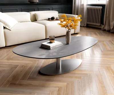Produktbild von DELIFE Couchtisch Edge Oval 140x75 cm Keramik Beton Grau Vibany Edelstahl gebürstet