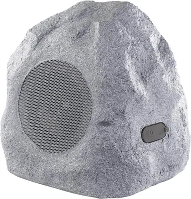 A single outdoor speaker designed to look like a rock.