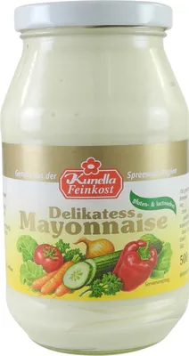 A jar of mayonnaise with vegetables depicted on the label.