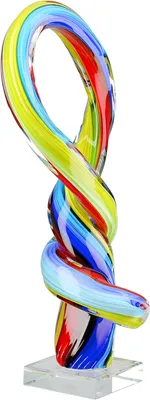 A colorful glass sculpture of a twisted loop on a clear base.