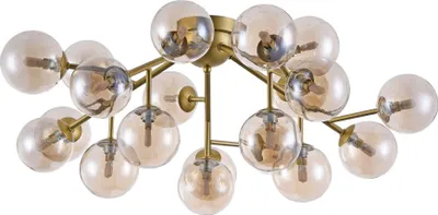 A close-up studio shot of a gold chandelier with many amber glass globes.