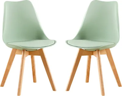 Two light green chairs with wooden legs on a white background.