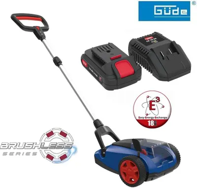 A product shot of a cordless lawnmower with its battery and charger.
