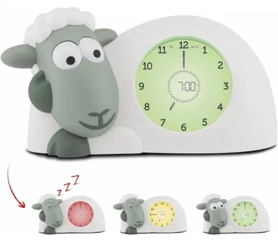 Imagen del producto de ZAZU Sam, el reloj de oveja: reloj entrenador del sueño y luz nocturna para niños. Ayuda a su hijo a aprender, mediante indicadores visuales, cuándo debe despertarse. Tiene brillo ajustable y se apaga automáticamente (función "cuenta cuentos")