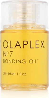 A close-up studio shot of a small bottle of Olaplex No. 7 Bonding Oil.