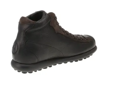 A single black and brown Camper boot is shown from the side against a white background.