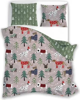 A bedding set with a Christmas dog theme, laid out on a white surface.
