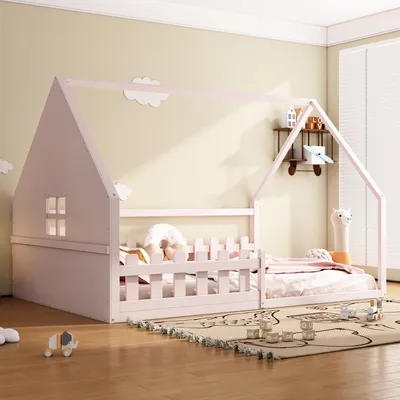 A child's bedroom with a pink house-shaped bed.