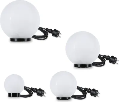 Four white globe lights with black bases and cords, arranged in a grid.