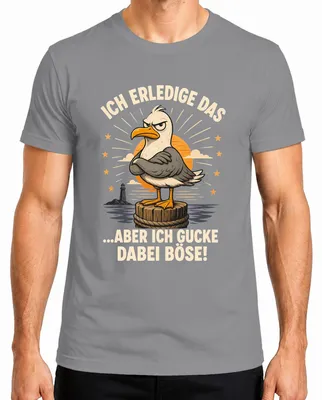 Imagen del producto de Camiseta gris, talla XL, con el estampado "Ich erledige das aber ich gucke dabei böse" (que se traduce como "Yo lo hago, pero lo hago con mala cara"), con un toque sarcástico