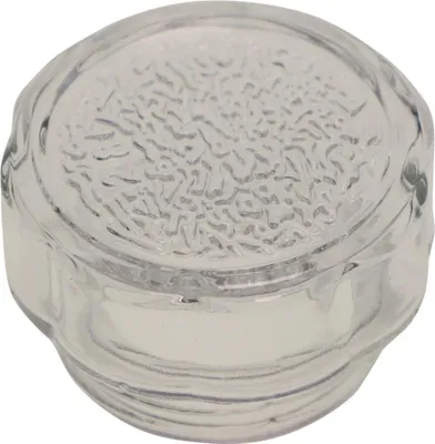 A close-up studio shot of a clear glass oven lamp cover with a textured surface.