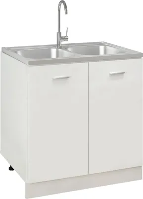 A white double sink with a silver faucet on a white cabinet.