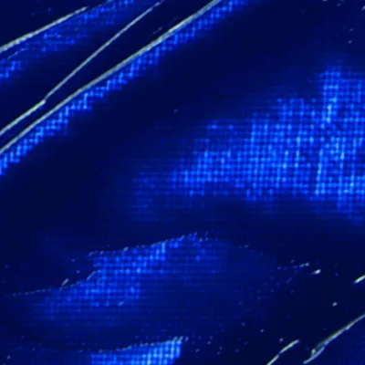 A close-up abstract view of a blue textured surface.
