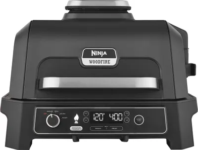 A black Ninja Woodfire Pro XL electric grill is shown from the front on a white background.